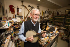 Photo Jim Kimball with musical instruments . Photo credit Keith Walters